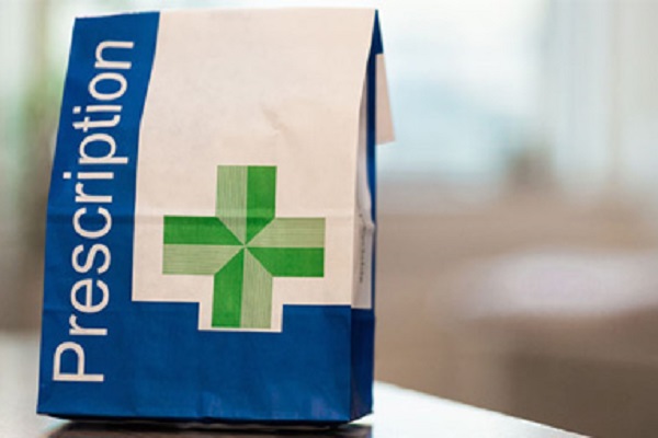 NHS prescriptions bag on a table top
