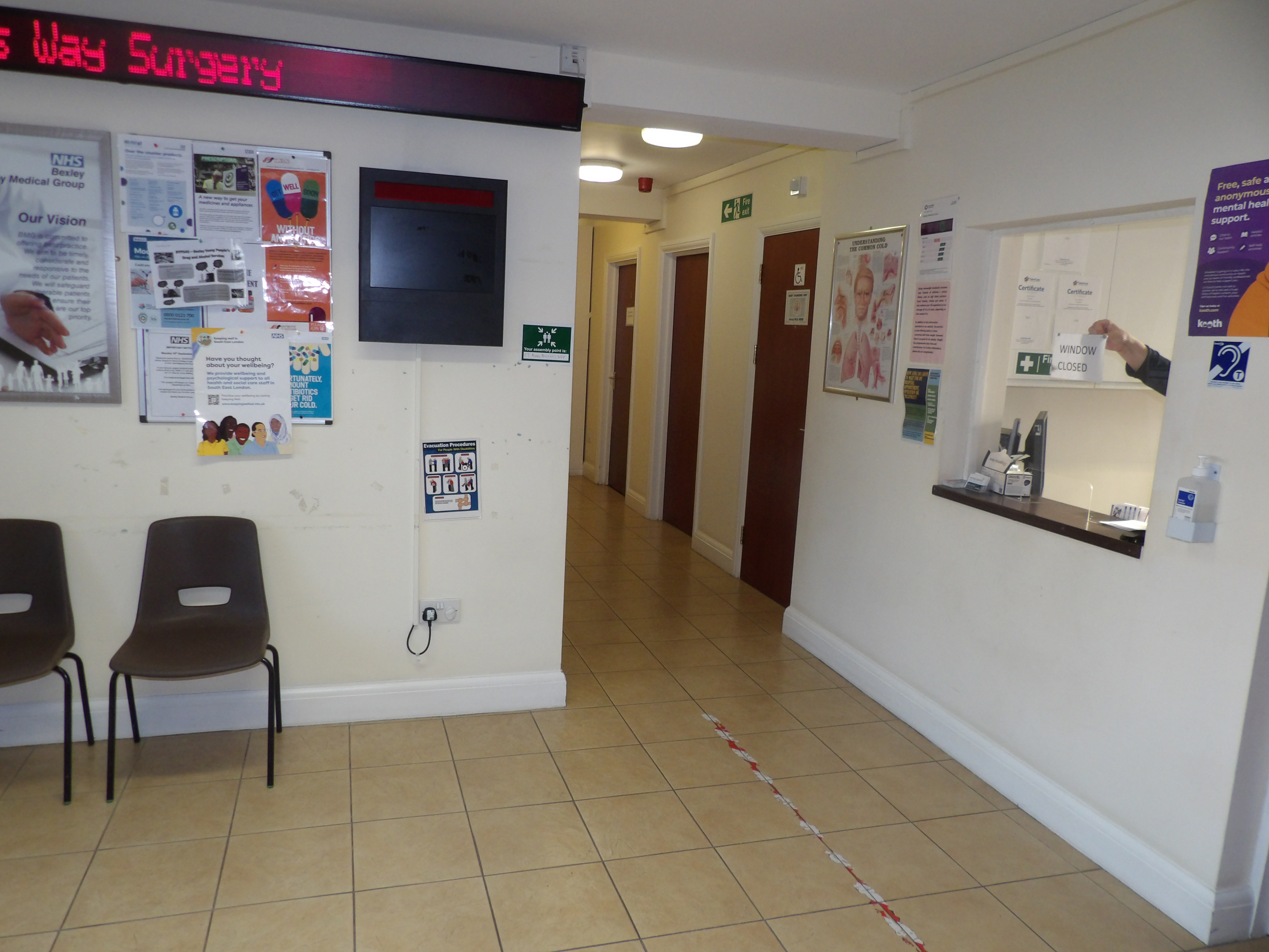 We have a lower counter at reception in the waiting room to the left